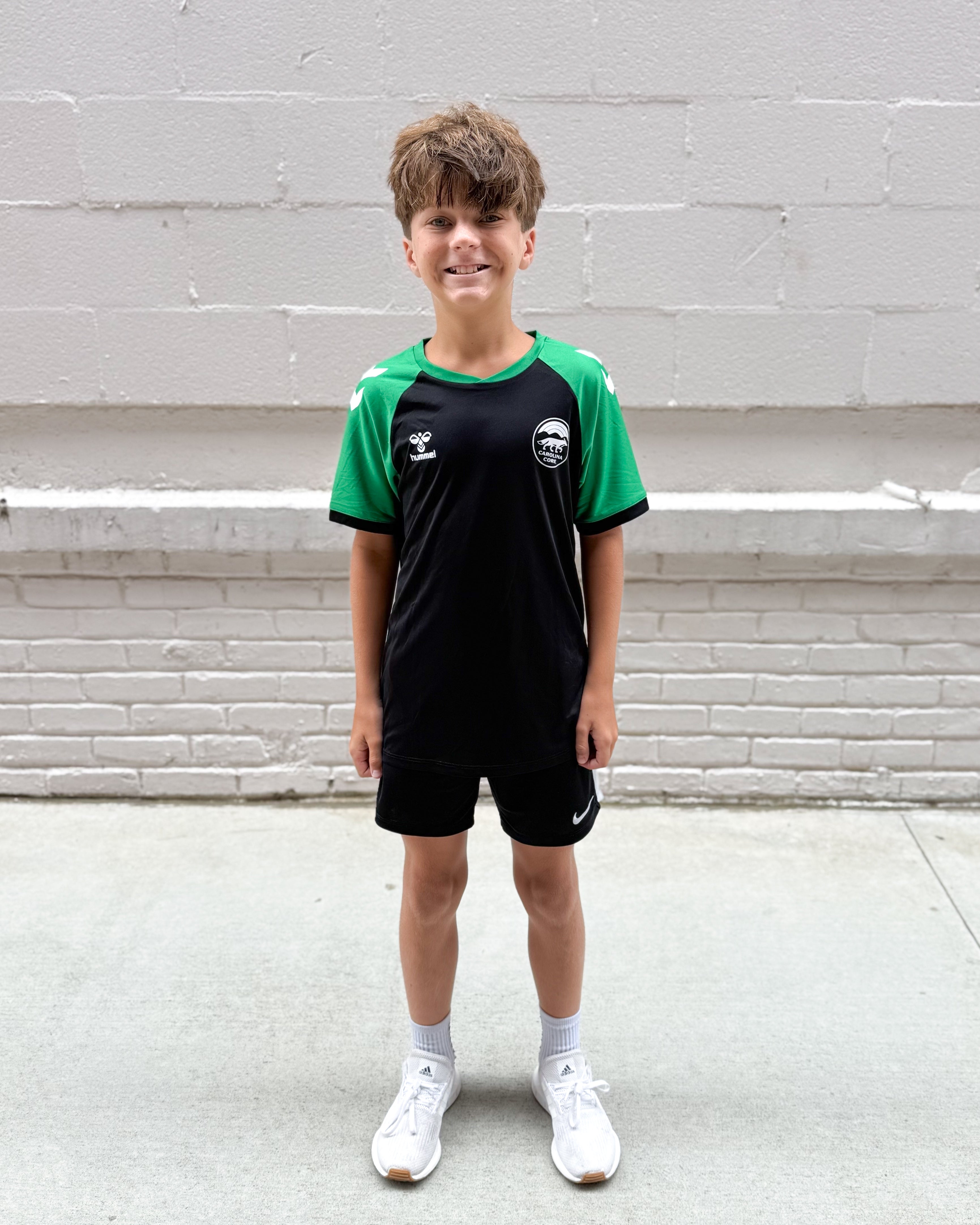 hummel Youth Black and Green Training Jersey