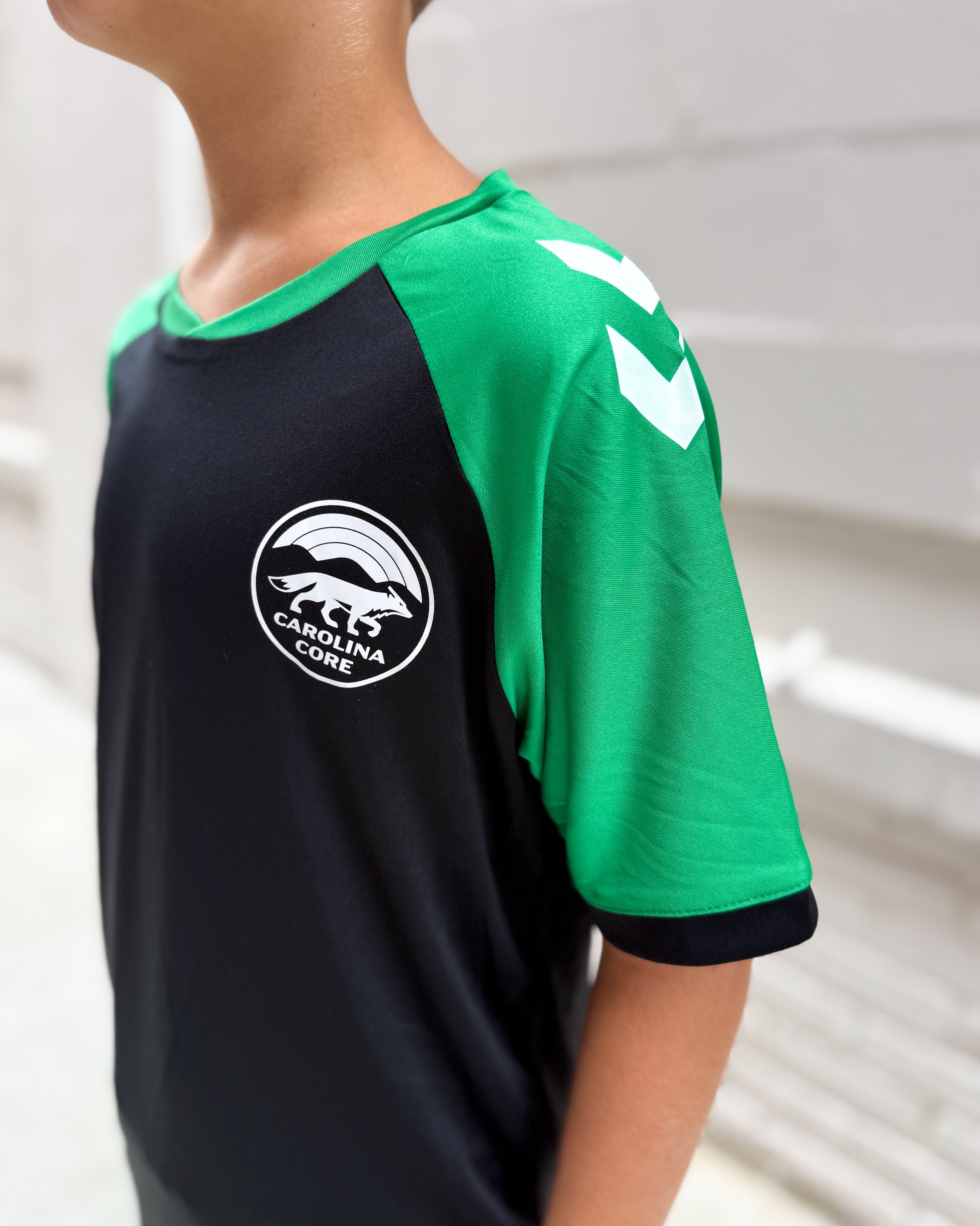 hummel Youth Black and Green Training Jersey