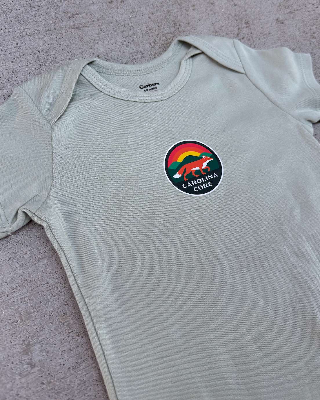 Green Logo Onesie